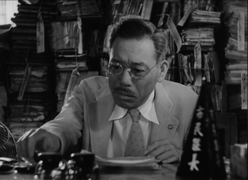 The meaningless bureaucratic job of pushing paper in Ikiru. 